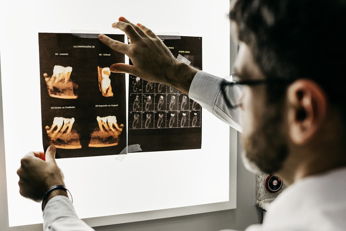 Dentist and assistant treating a patient in a dental operatory