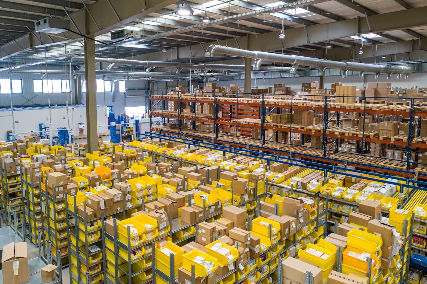 Worker packing online orders in an ecommerce fulfillment warehouse
